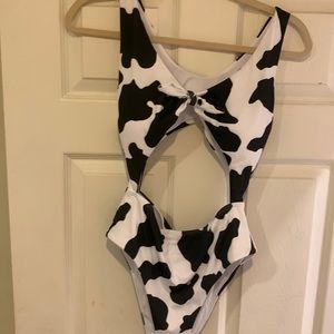 Women’s one piece cow print bathing suit. Size Large